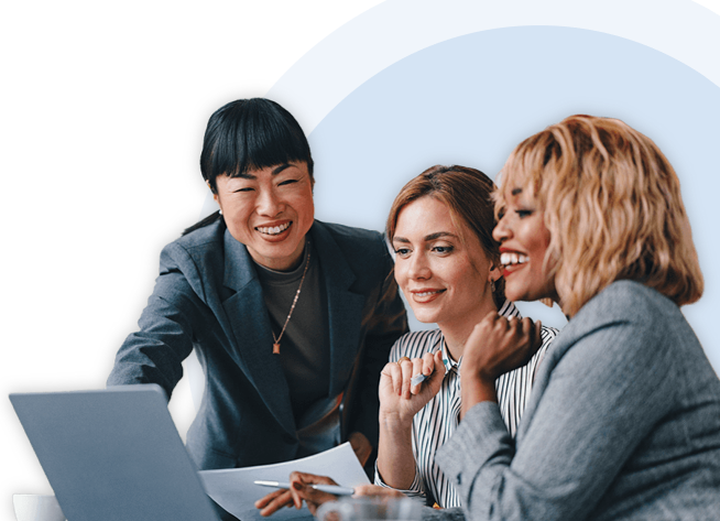 Woman with black curly hair wearing a backpack in a hallway holding and about to tap a phone
